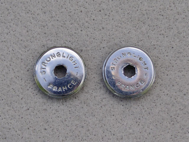 <------------------ SOLD ------------------> Stronglight crank arm dust caps (USED)