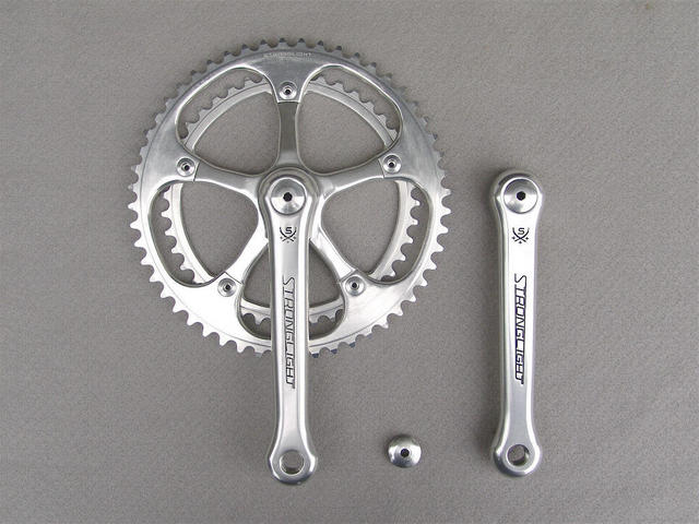 <------------------ SOLD ------------------> Stronglight 107 crankset - 42/52 double - 144 mm BCD (NOS / USED)